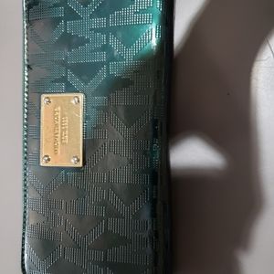 Michael Kors green wallet with shiny areas